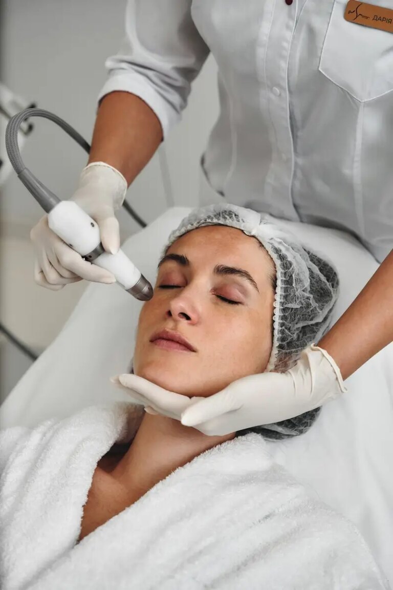 Aesthetic treatment session on a womans face in a modern clinic