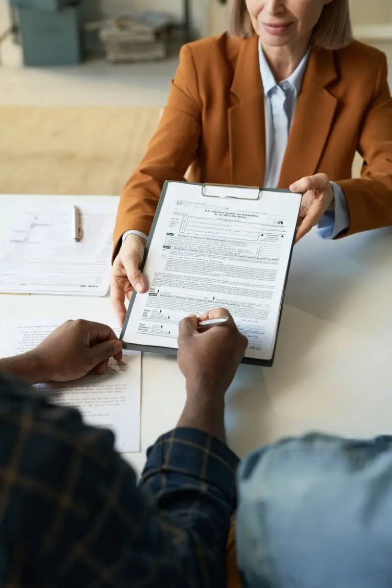 Black Man Signing Tax Declaration Form