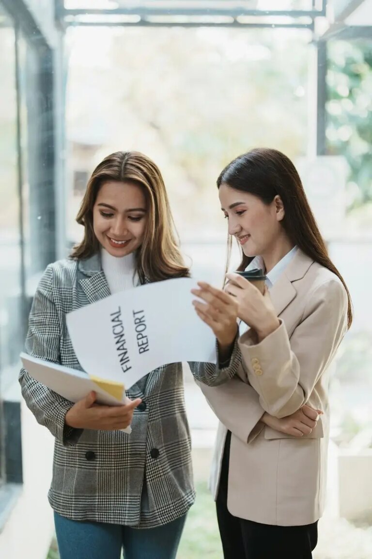 Financial analysts analyzing business reports on planned investment projects during corporate meetin